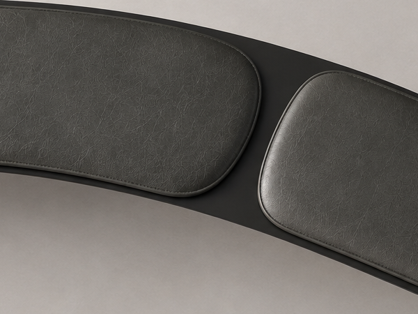 Close view of the two cushion edges and the exposed continuous steel plane between them.